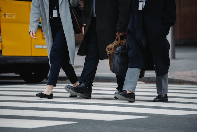 people walking in a cross walk