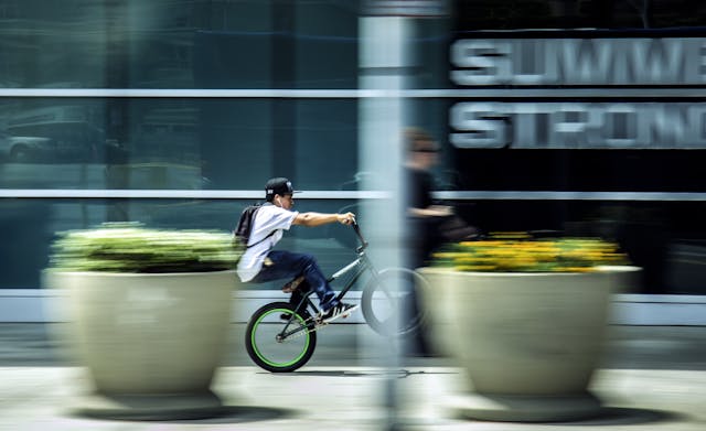 person riding bicycle on street