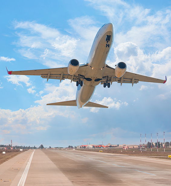 passenger jet flying off a runway