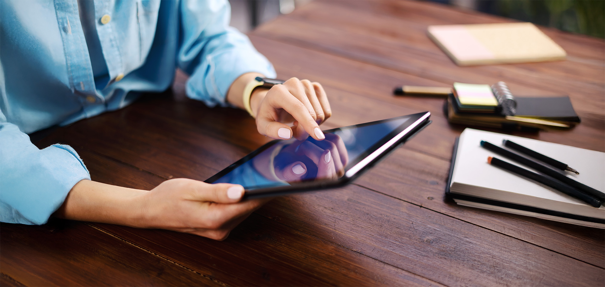 Woman pointing on digital tablet screen