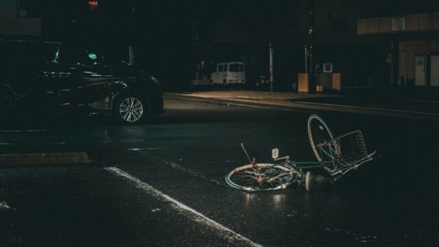 bicycle laying on asphalt